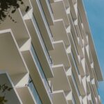 Contemporary apartment building facade in Malé, showcasing modern architectural design and geometric patterns.
